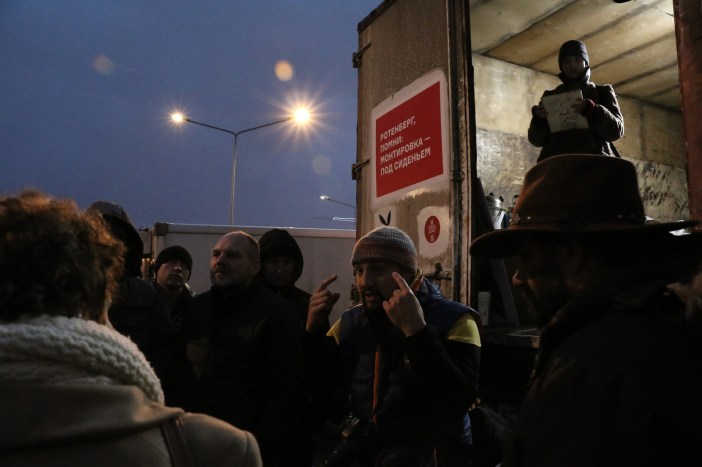 Victoria Lomasko (top right) making a graphic reportage of the proceedings (see below), Khimki, December 26, 2015.