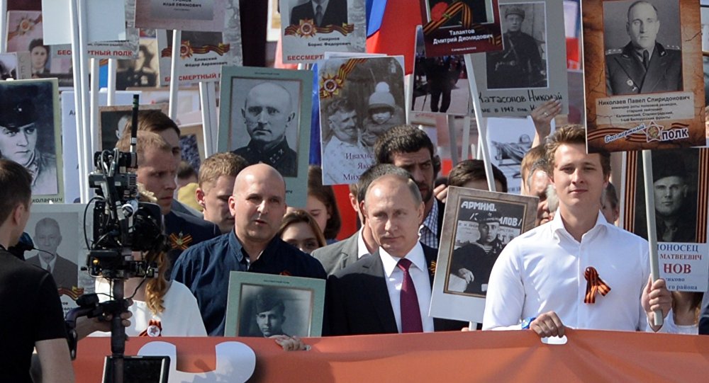 Vladimir Putin leading Immortal Regiment march in Moscow, May 9, 2016. Photo: Ilya Pitalev/Sputnik