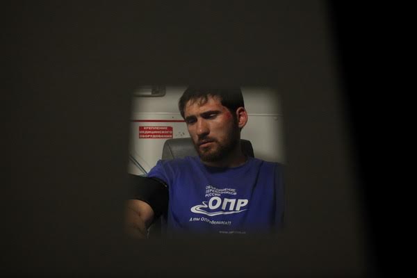 Rustam Mallamagomedov in an ambulance after being beaten. Village of Dorozhnyi, August 22, 2016